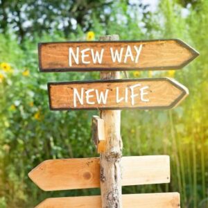 Sign post with arrows pointing left with the words new way new life
