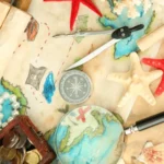 Map of the world, with a compass, treasure chest, and stars