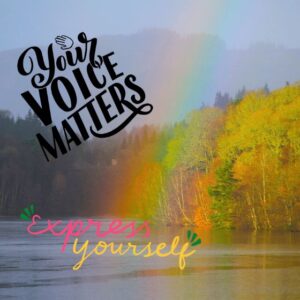 Use Your voice - express yourself. In the background trees stand tall painted in the colors of the rainbow and a large lake in the front