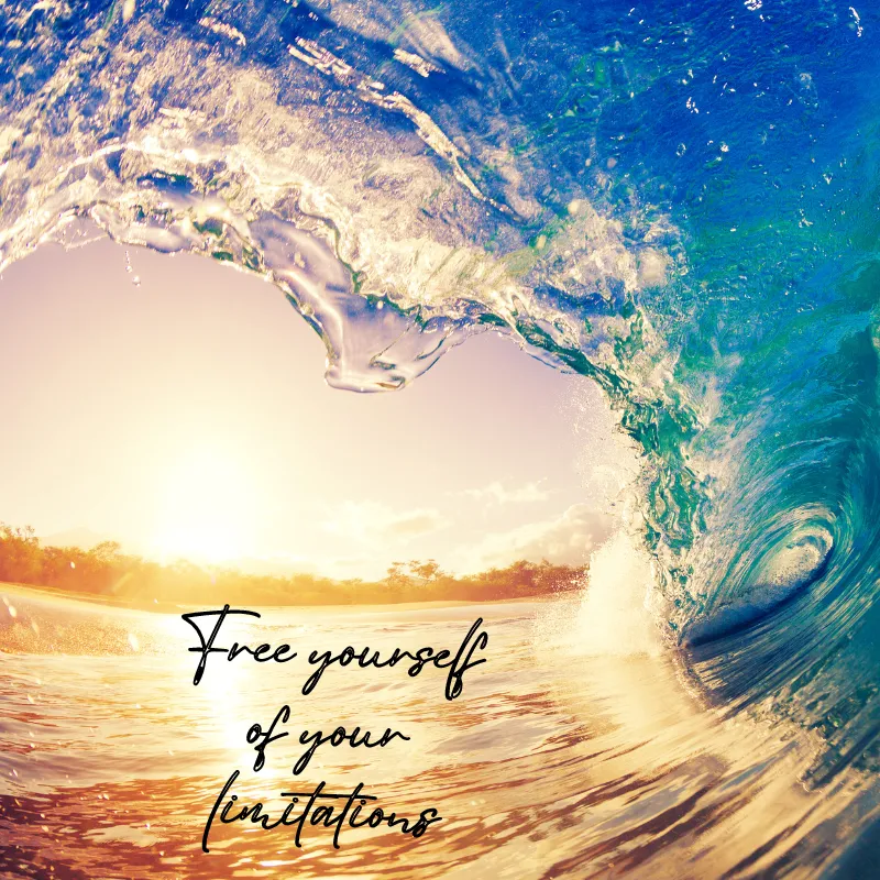 A blue wave of water against a sunset sky. The water forms a heart with the words, " free yourself of your limitations'.
